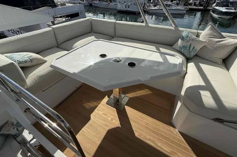 Slide: The Image of Luxurious seating area on 2026 Aventura 38 Motor Yacht with elegant table and cushions. - 19