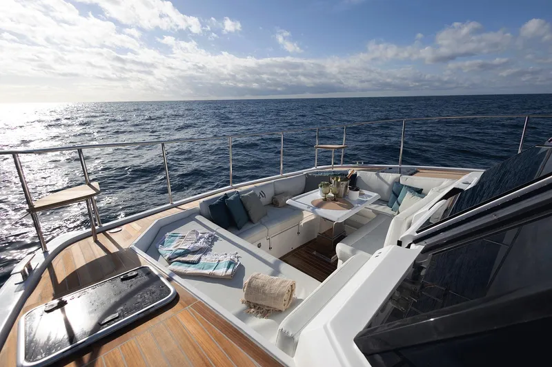 Slide: The Image of Luxurious Aventura 38 Motor Yacht 2026 with elegant deck seating, ocean view. - 13