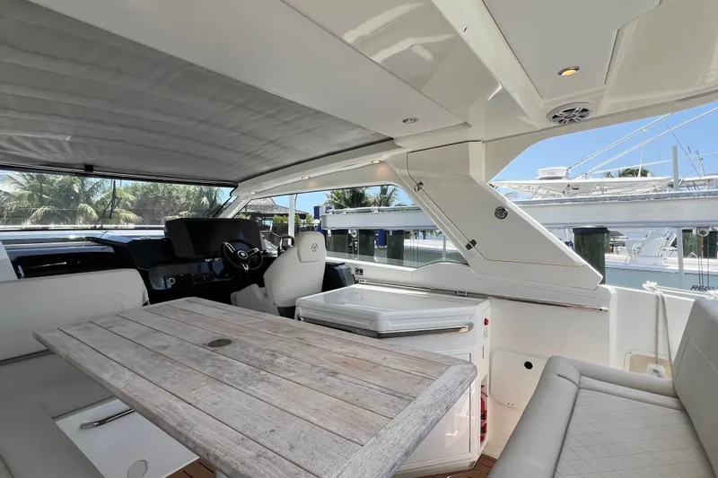 Slide: The Image of Luxurious interior of 2024 Skamander 100 Sorrento yacht with elegant seating and wooden table. - 160