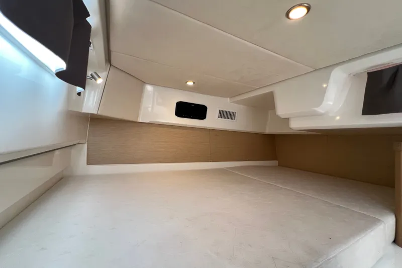 Slide: The Image of 2024 Skamander 100 Sorrento cabin interior with modern lighting and cozy sleeping area. - 186