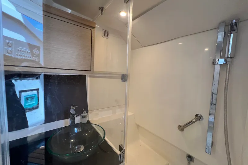 Slide: The Image of 2024 Skamander 100 Sorrento yacht bathroom with modern fixtures and glass sink. - 138