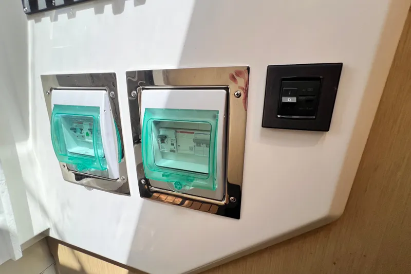 Slide: The Image of Electrical panel and switch in 2024 Skamander 100 Sorrento boat interior. - 133