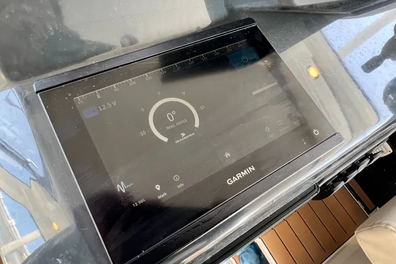 Slide: The Image of Garmin display on 2024 Skamander 100 Sorrento showing roll angle and voltage. - 159