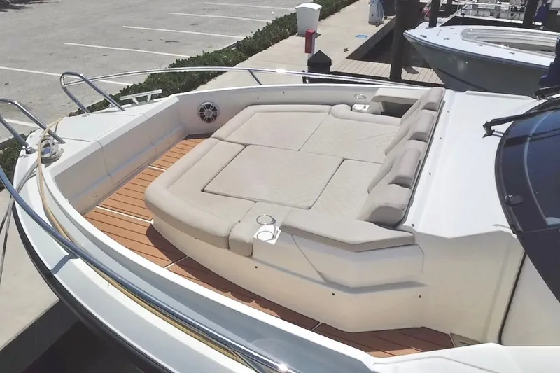 Slide: The Image of 2024 Skamander 100 Sorrento boat with spacious sunbathing deck and cushioned seating. - 46