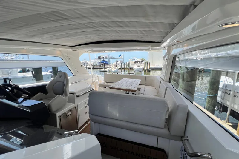 Slide: The Image of Interior of 2024 Skamander 100 Sorrento yacht with luxurious seating and waterfront view. - 165