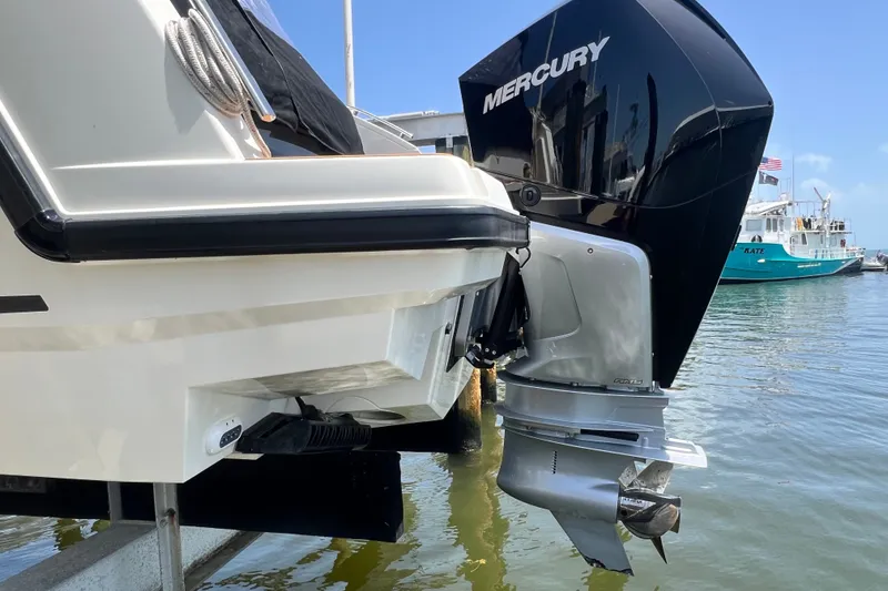 Slide: The Image of 2024 Skamander 100 Sorrento boat with Mercury outboard engine at dockside. - 56