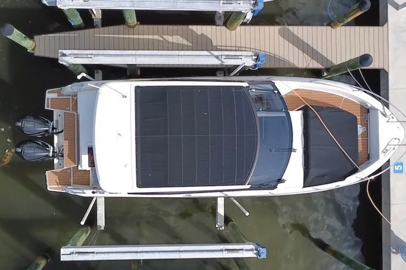 Slide: The Image of Aerial view of a 2024 Skamander 100 Sorrento boat docked at a pier. - 11