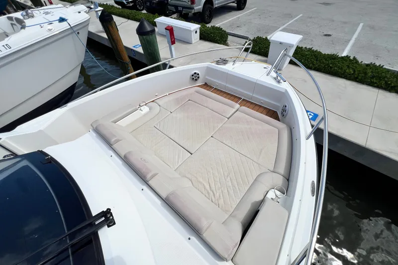 Slide: The Image of 2024 Skamander 100 Sorrento boat with spacious cushioned seating area at the bow. - 103