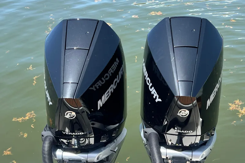 Slide: The Image of Twin Mercury Verado outboard motors on a Skamander 100 Sorrento, 2024 model, in water. - 62