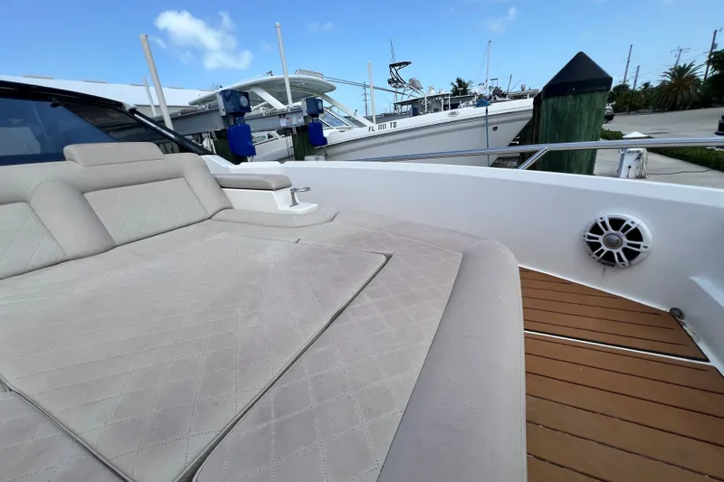 Slide: The Image of Luxurious deck seating on 2024 Skamander 100 Sorrento yacht, docked at marina. - 106