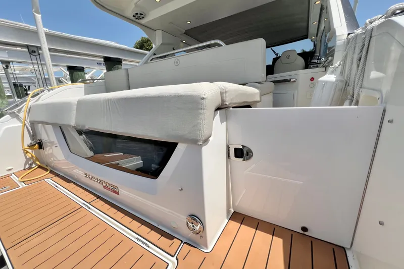 Slide: The Image of 2024 Skamander 100 Sorrento yacht with teak deck and cushioned seating area. - 71