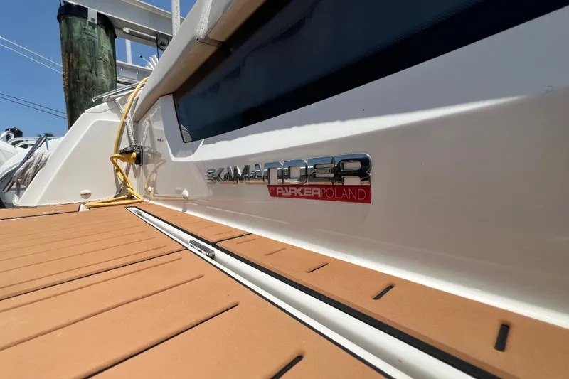 Slide: The Image of 2024 Skamander 100 Sorrento boat with Parker Poland branding on deck. - 75