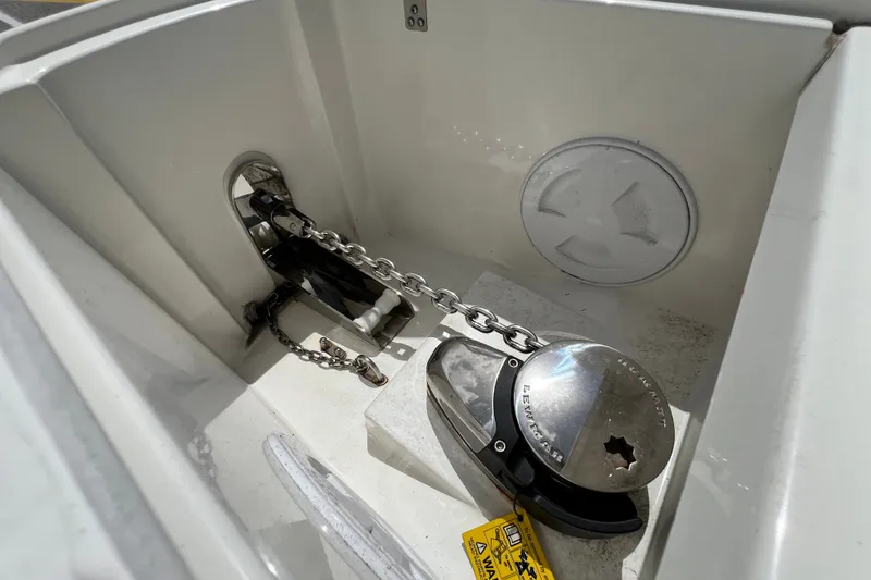 Slide: The Image of Anchor chain compartment of 2024 Skamander 100 Sorrento boat, featuring Lewmar windlass. - 95