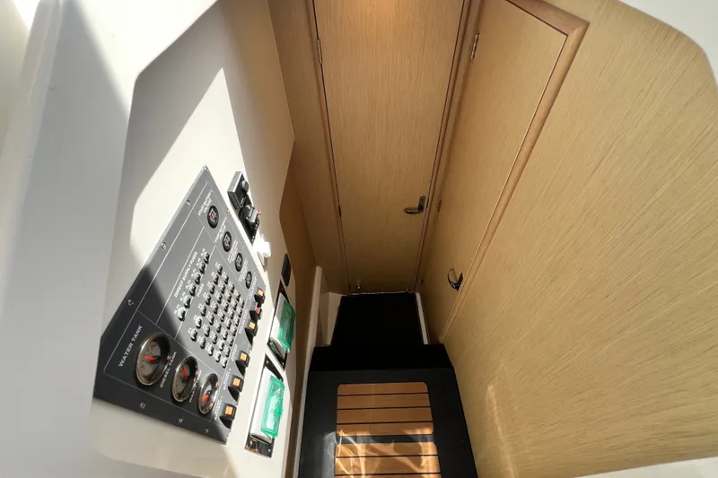 Slide: The Image of 2024 Skamander 100 Sorrento interior with control panel and wooden door. - 131