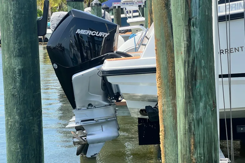 Slide: The Image of 2024 Skamander 100 Sorrento boat with Mercury outboard motor at dock. - 23