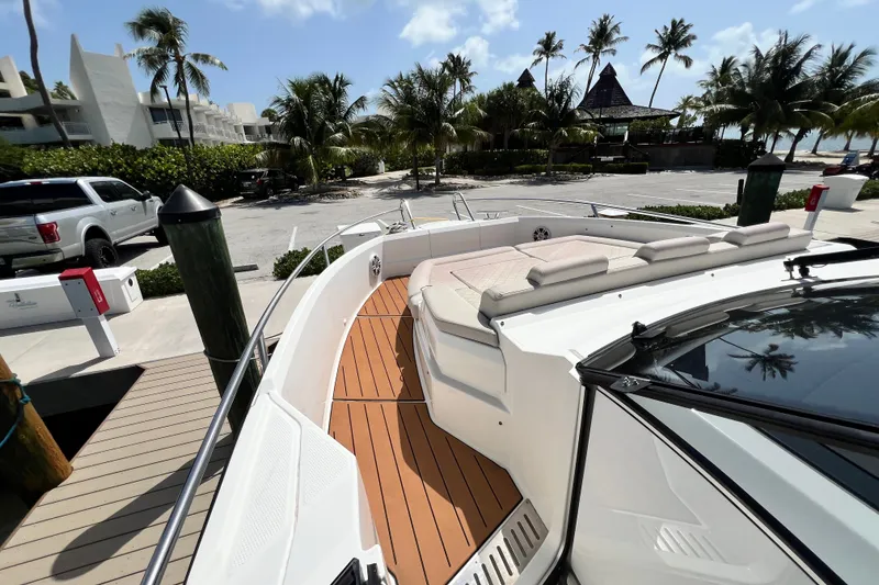 Slide: The Image of 2024 Skamander 100 Sorrento yacht docked, featuring spacious deck and luxurious seating. - 88