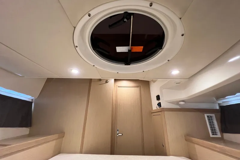 Slide: The Image of Interior cabin of 2024 Skamander 100 Sorrento boat with ceiling hatch. - 147