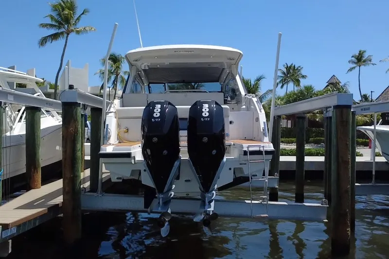 Slide: The Image of 2024 Skamander 100 Sorrento yacht docked with dual 300 V8 engines. - 4