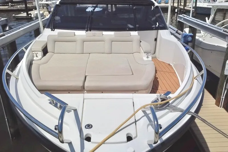 Slide: The Image of 2024 Skamander 100 Sorrento boat with spacious deck and comfortable seating at dock. - 41