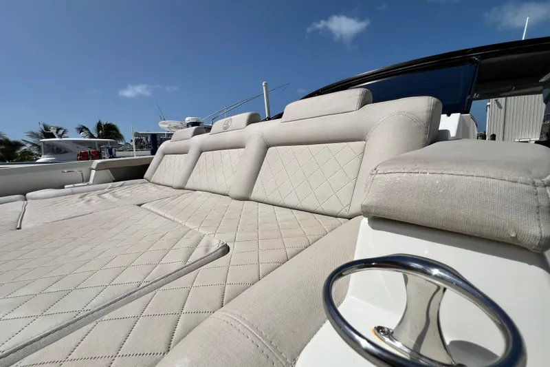 Slide: The Image of Luxurious seating on 2024 Skamander 100 Sorrento yacht under clear blue sky. - 89