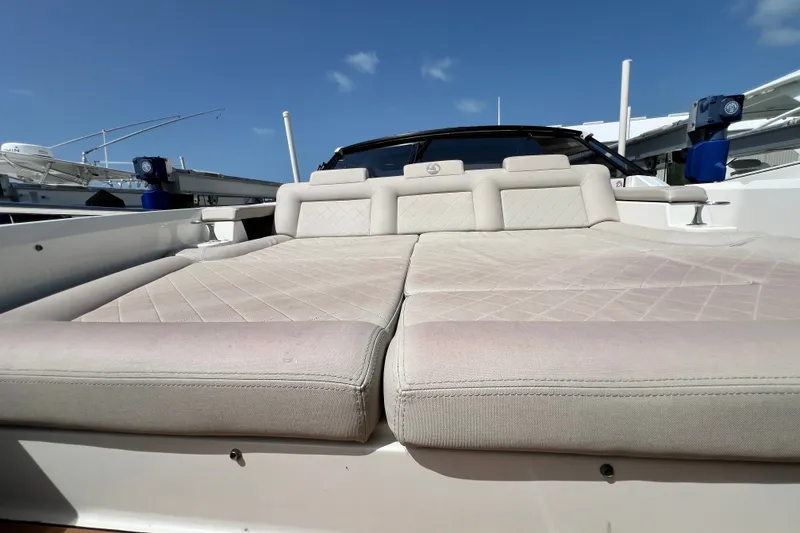 Slide: The Image of 2024 Skamander 100 Sorrento yacht with luxurious beige sunbed under clear blue sky. - 97