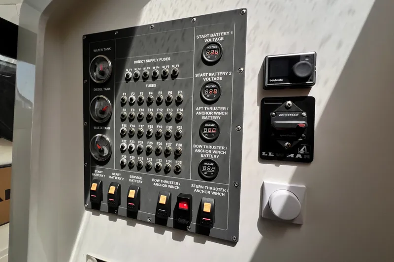 Slide: The Image of Control panel of 2024 Skamander 100 Sorrento boat with gauges and switches. - 132
