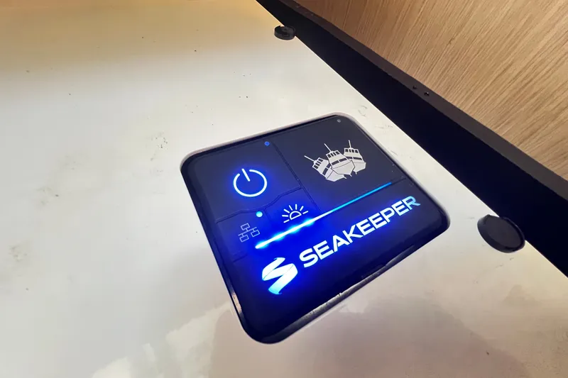 Slide: The Image of Control panel of a 2024 Skamander 100 Sorrento featuring Seakeeper stabilization system. - 180