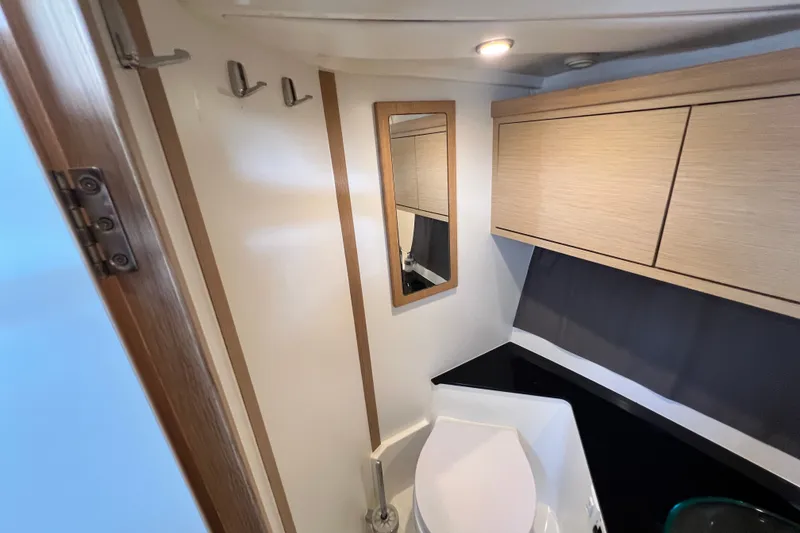 Slide: The Image of 2024 Skamander 100 Sorrento bathroom with modern fixtures and wooden cabinetry. - 140