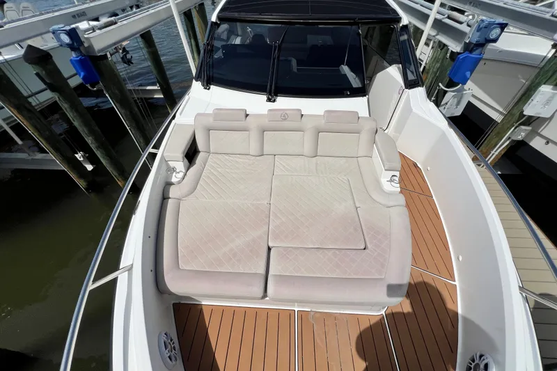 Slide: The Image of 2024 Skamander 100 Sorrento boat with spacious deck and cushioned seating. - 101