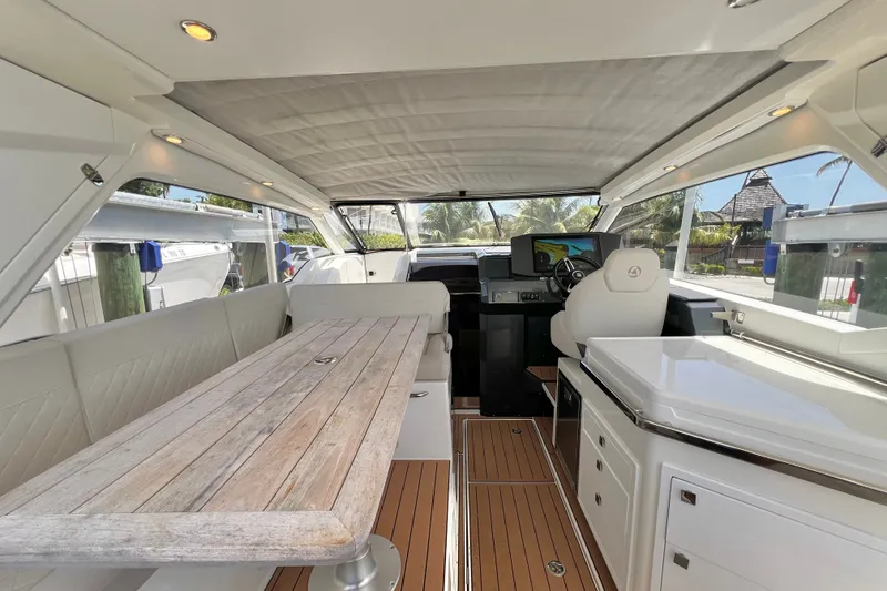 Slide: The Image of 2024 Skamander 100 Sorrento yacht interior with elegant seating and modern navigation controls. - 70