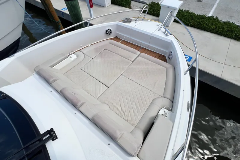 Slide: The Image of 2024 Skamander 100 Sorrento boat with spacious cushioned seating area. - 104