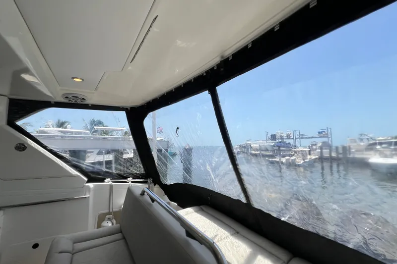 Slide: The Image of Interior view of 2024 Skamander 100 Sorrento yacht, overlooking marina through large windows. - 179