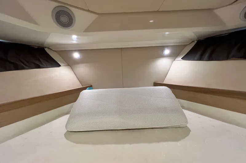 Slide: The Image of 2024 Skamander 100 Sorrento cabin interior with cozy bedding and ambient lighting. - 145