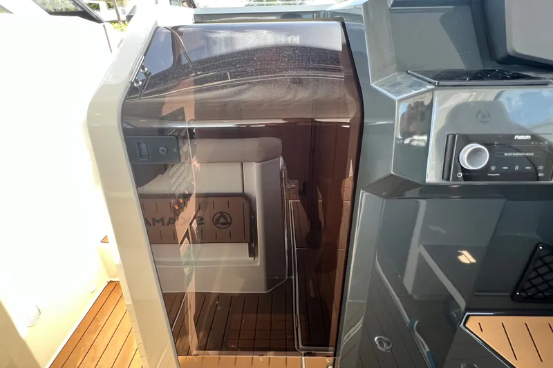 Slide: The Image of 2024 Skamander 100 Sorrento boat interior with sleek design and modern controls. - 130