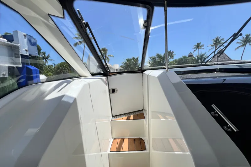 Slide: The Image of Interior view of 2024 Skamander 100 Sorrento boat with tropical background. - 121
