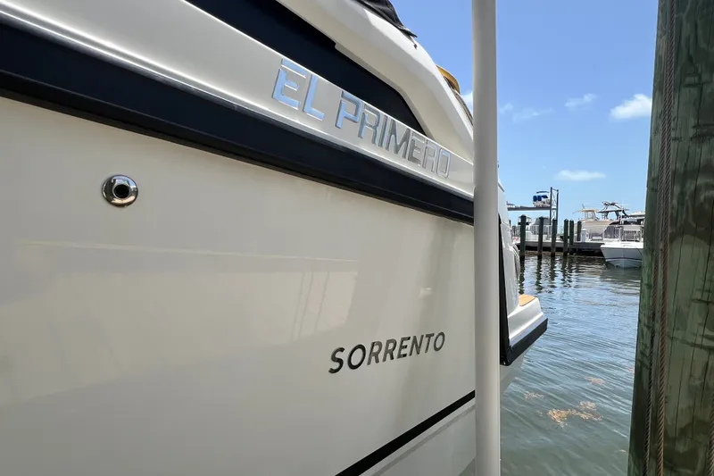 Slide: The Image of 2024 Skamander 100 Sorrento boat docked, featuring "El Primero" nameplate. - 49