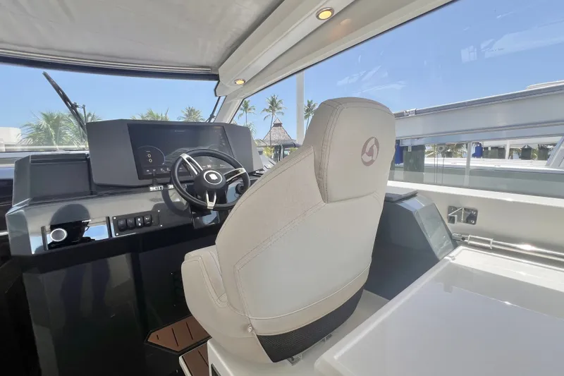Slide: The Image of Interior of 2024 Skamander 100 Sorrento boat with modern steering console. - 123