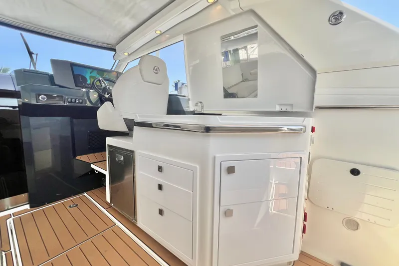Slide: The Image of 2024 Skamander 100 Sorrento yacht interior with modern helm and sleek cabinetry. - 152