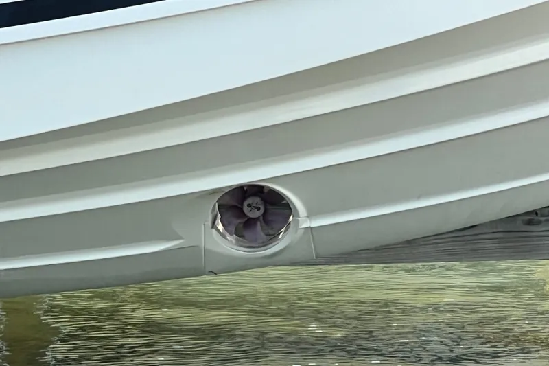 Slide: The Image of 2024 Skamander 100 Sorrento boat hull with visible bow thruster in water. - 28