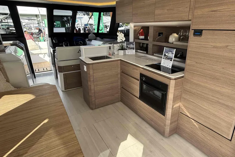 Slide: The Image of Interior of 2026 Aventura 38 Motor Yacht with modern kitchen and helm station. - 10