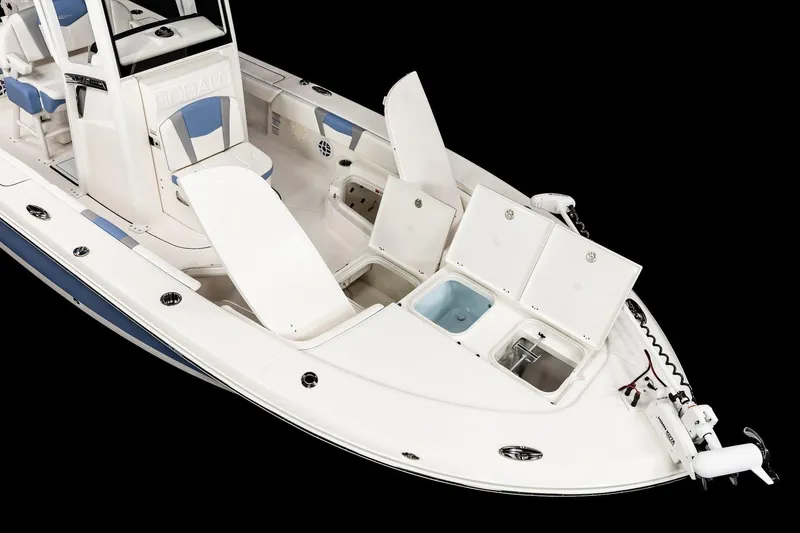 Slide: The Image of Manufacturer Provided Image: 2025 Robalo 246 Cayman boat with open storage compartments, white and blue interior. - 6