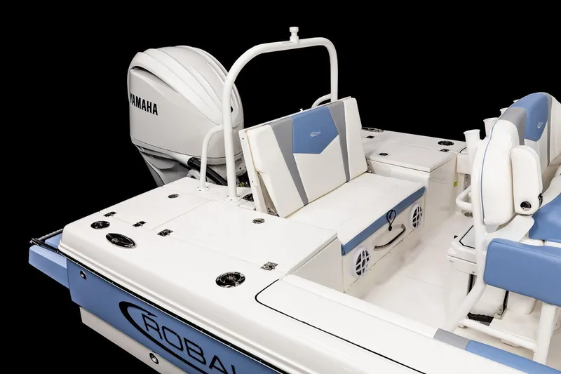 Slide: The Image of Manufacturer Provided Image: 2025 Robalo 246 Cayman boat with Yamaha engine, featuring sleek white and blue design. - 9
