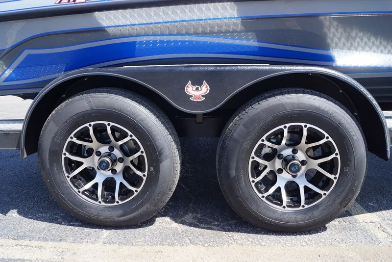 Slide: The Image of 2027 Phoenix 721 ZXL trailer with dual wheels and blue detailing. - 5