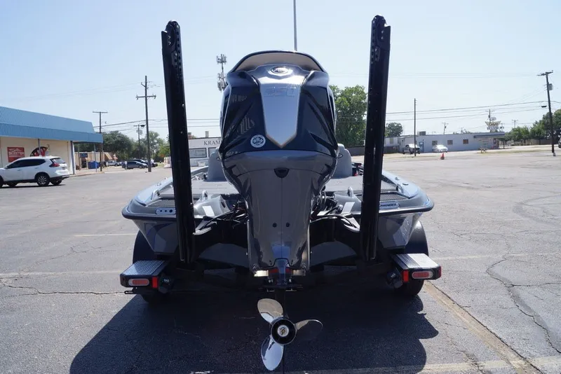 Slide: The Image of 2027 Phoenix 721 ZXL boat rear view in parking lot. - 1