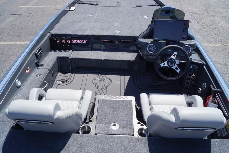 Slide: The Image of Interior of a 2027 Phoenix 721 ZXL boat with modern dashboard and seating. - 7