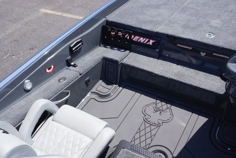 Slide: The Image of Interior of 2027 Phoenix 721 ZXL boat with gray seating and carpeted deck. - 8