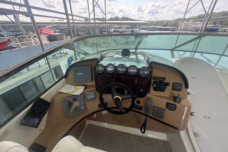 Slide: The Image of Pilothouse of 2003 Carver 570 Voyager with steering wheel and navigation instruments. - 17