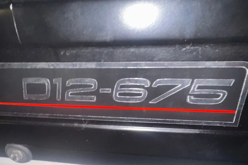 Slide: The Image of Close-up of D12-675 engine label on 2003 Carver 570 Voyager Pilothouse. - 30