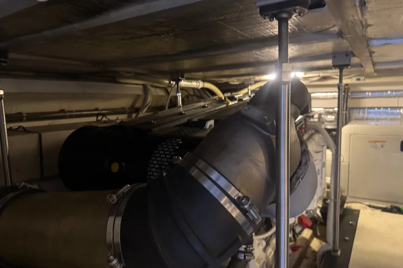 Slide: The Image of Engine room of 2003 Carver 570 Voyager Pilothouse with visible pipes and machinery. - 28