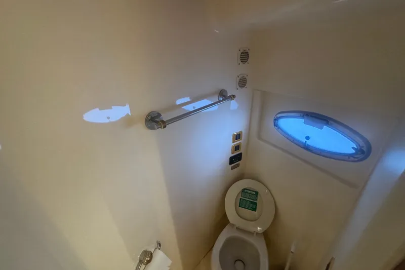 Slide: The Image of Bathroom interior of 2003 Carver 570 Voyager Pilothouse yacht with porthole window. - 23
